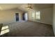 Spacious living room with carpeted floors and high ceilings at 90 Faucette Dr, Selma, NC 27576