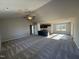 Open-concept living room with kitchen and dining area at 90 Faucette Dr, Selma, NC 27576