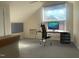 Attic conversion with modern computer setup, natural light and grey carpet at 943 St Marys St # B, Raleigh, NC 27605