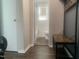 A sleek bathroom view with tile details, a toilet, and a coat rack adding functional style to the space at 943 St Marys St # B, Raleigh, NC 27605