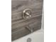 Detailed shot of the bathtub faucet with updated wood-style tiles and clean, white subway tiles at 943 St Marys St # B, Raleigh, NC 27605
