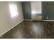 A simple bedroom with laminate flooring and natural light, perfect for rest and relaxation at 943 St Marys St # B, Raleigh, NC 27605