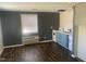 A modern kitchen and living space with a window, stylish cabinets, a stove, and a sink for cooking ease at 943 St Marys St # B, Raleigh, NC 27605