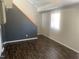 Spacious living room offers wood flooring, natural light, and neutral color scheme at 943 St Marys St # B, Raleigh, NC 27605