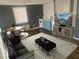 A bright living space with modern decor, a window, and a TV creating a comfortable and inviting atmosphere at 943 St Marys St # B, Raleigh, NC 27605