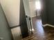 A staircase with wood-look flooring leads to a lower level, offering practical access and transition between floors at 943 St Marys St # B, Raleigh, NC 27605