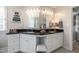 Elegant bathroom with a double vanity and black marble countertop at 1001 Chimney Hill Dr, Apex, NC 27502