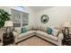 Comfortable sitting area with a sectional sofa and large mirror at 1001 Chimney Hill Dr, Apex, NC 27502