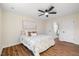 Bright bedroom with ceiling fan and hardwood flooring at 1013 Castalia Dr, Cary, NC 27513