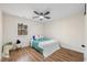 Bright bedroom with a bed, ceiling fan, and window at 1013 Castalia Dr, Cary, NC 27513