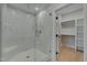 Spa-like bathroom with a large walk-in shower and bench at 1016 Manor Way, Durham, NC 27701