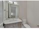 Clean bathroom with white vanity and toilet; modern design at 1016 Manor Way, Durham, NC 27701