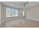 Light-filled bedroom with hardwood floors and large windows at 1016 Manor Way, Durham, NC 27701