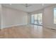 Bright bedroom with hardwood floors and sliding glass doors to deck at 1016 Manor Way, Durham, NC 27701