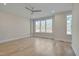 Bright bedroom featuring hardwood floors and large windows at 1016 Manor Way, Durham, NC 27701