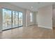 Spacious bedroom with hardwood floors and access to private deck at 1016 Manor Way, Durham, NC 27701