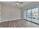 Bright bedroom with hardwood floors, sliding glass doors to balcony at 1016 Manor Way, Durham, NC 27701