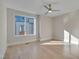 Bright bedroom with hardwood floors and large window at 1016 Manor Way, Durham, NC 27701