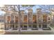 Row of modern townhouses featuring brick accents and private balconies at 1016 Manor Way, Durham, NC 27701