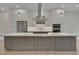 Modern kitchen with stainless steel appliances and a large island at 1016 Manor Way, Durham, NC 27701