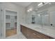 Modern bathroom boasts double vanity, large mirror, and walk-in shower at 1018 Manor Way, Durham, NC 27701