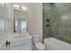 Modern bathroom with green tile and a white vanity at 1018 Manor Way, Durham, NC 27701