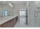 Bathroom with double vanity and a glass-enclosed shower at 1018 Manor Way, Durham, NC 27701
