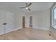 Bright bedroom with hardwood floors and ceiling fan at 1018 Manor Way, Durham, NC 27701