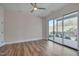 Spacious bedroom with hardwood floors and access to a private balcony at 1018 Manor Way, Durham, NC 27701