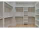 Large walk-in closet with ample shelving and hanging space at 1018 Manor Way, Durham, NC 27701