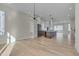 Modern dining room features hardwood floors and a stylish light fixture at 1018 Manor Way, Durham, NC 27701