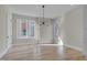 Bright dining room with hardwood floors and large windows at 1018 Manor Way, Durham, NC 27701
