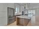 Modern kitchen with stainless steel appliances and an island at 1018 Manor Way, Durham, NC 27701