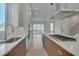 Modern kitchen with stainless steel appliances and island at 1018 Manor Way, Durham, NC 27701