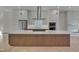 Contemporary kitchen features a large island and modern cabinetry at 1018 Manor Way, Durham, NC 27701