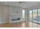 Living room features a fireplace and sliding glass doors to deck at 1018 Manor Way, Durham, NC 27701
