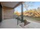 Private patio with brick wall and access to green space at 1018 Manor Way, Durham, NC 27701