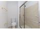 Bathroom with toilet, shower, and tiled floor at 1019 Thistle Briar Pl, Cary, NC 27511