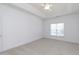 Bright bedroom with neutral carpeting and ceiling fan at 1019 Thistle Briar Pl, Cary, NC 27511