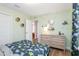 Dinosaur-themed bedroom with light green walls and dresser at 104 Davinhall Dr, Fuquay Varina, NC 27526