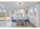 Sun-drenched dining area with table and chairs, plus sliding doors at 104 Davinhall Dr, Fuquay Varina, NC 27526