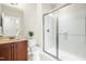 Bathroom featuring a single vanity, shower with glass door and neutral colors at 10511 Sablewood Dr # 110, Raleigh, NC 27617