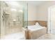 Bright bathroom featuring large tub and separate glass shower with tile surround at 10511 Sablewood Dr # 110, Raleigh, NC 27617