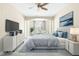 Bright bedroom featuring modern furniture, a ceiling fan, and neutral color tones at 10511 Sablewood Dr # 110, Raleigh, NC 27617