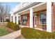 Charming brick townhome porch with seating and landscaped garden at 10511 Sablewood Dr # 110, Raleigh, NC 27617