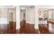 Inviting hallway with hardwood floors, leading to an open kitchen and other areas of the home at 10511 Sablewood Dr # 110, Raleigh, NC 27617
