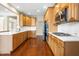 Bright kitchen with stainless steel appliances and white marble countertops at 10511 Sablewood Dr # 110, Raleigh, NC 27617