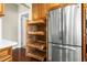 Kitchen featuring pull-out shelving, stainless steel refrigerator and sleek design at 10511 Sablewood Dr # 110, Raleigh, NC 27617