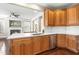 Kitchen with view to fireplace, featuring stainless steel appliances and bar seating at 10511 Sablewood Dr # 110, Raleigh, NC 27617