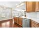 Bright kitchen with white countertops, stainless steel appliances, and cabinetry at 10511 Sablewood Dr # 110, Raleigh, NC 27617